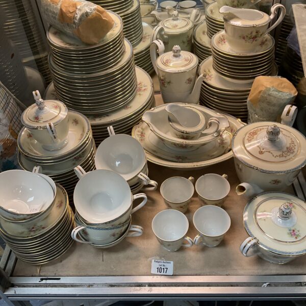 Vintage Noritake dinner set with floral patterns and gilded edges.