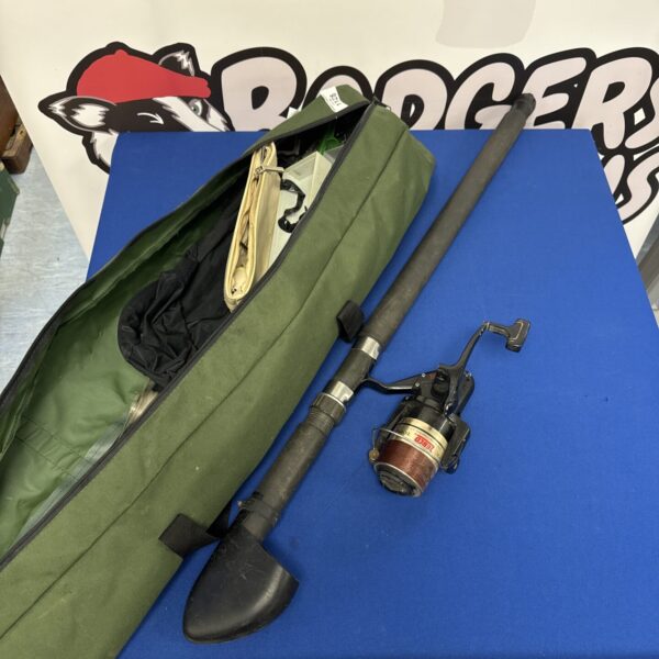 Green bag containing a sea fishing rod and Zebco reel.