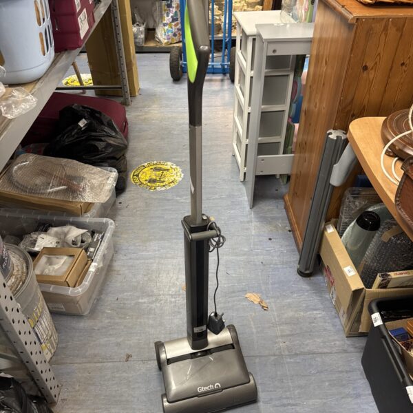 Gtech AirRam cordless vacuum cleaner in a home setting.