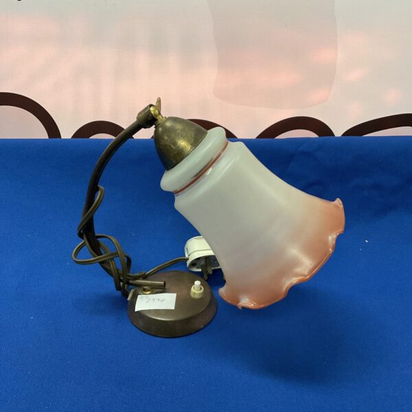 Vintage tulip table lamp with translucent shade and metal base.