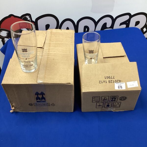 Lot of twenty-four Stowford Press pint and half-pint glasses.