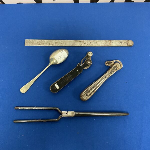 Vintage can opener lot with military spoon and glove stretcher.