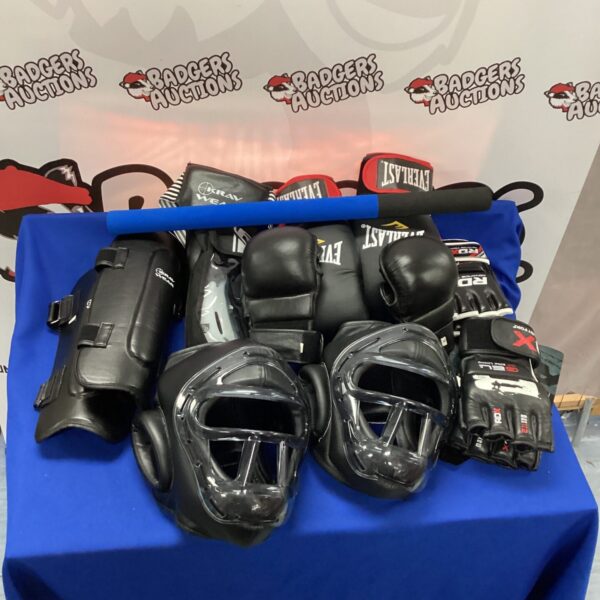 Boxing equipment set with gloves and headgear for training.