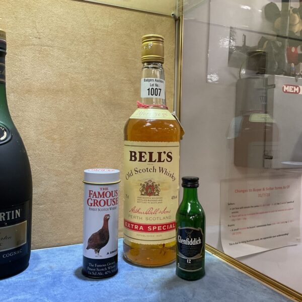 Bells whisky bottle with Famous Grouse and Glenfiddich miniatures.
