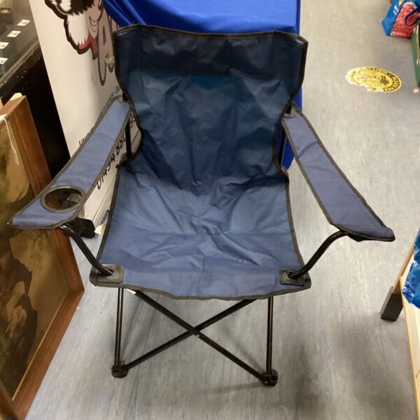 Blue folding camping chair with cup holder, perfect for outdoor use.