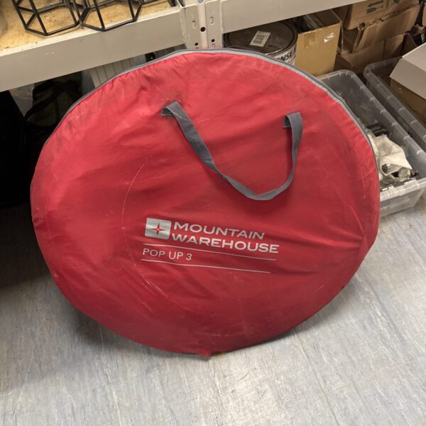Collapsed Mountain Warehouse pop up tent ready for camping.