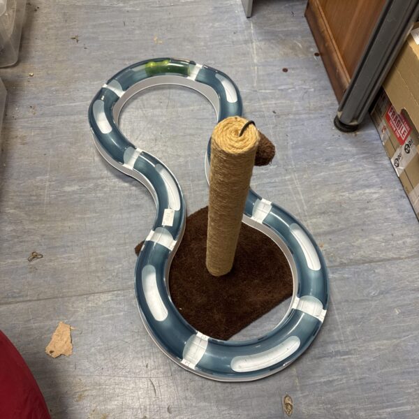 Interactive cat ball chaser toy with scratching post for indoor cats.