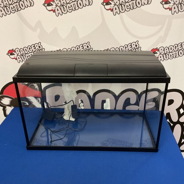 Small rectangular fish tank with LED light strip for aquatic life.