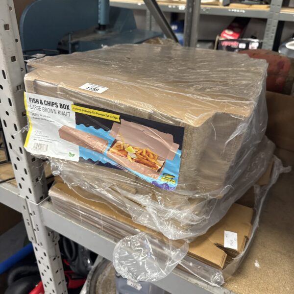 Stack of used cardboard catering food boxes for takeaway.