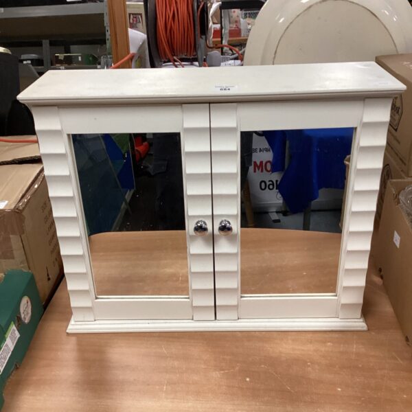 Vintage white mirrored bathroom cabinet for storage.