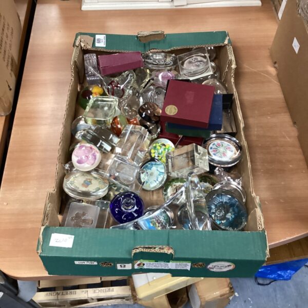Collection of colourful glass paperweights for collectors.