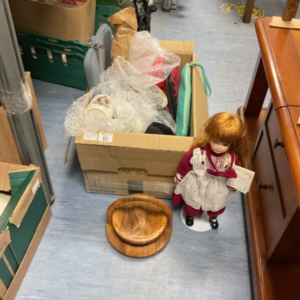 Detailed porcelain doll from The Hamilton Collection, a collectible figurine.