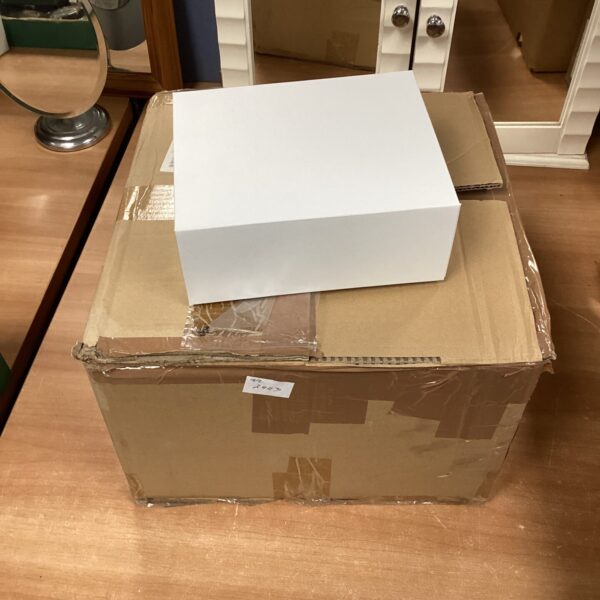 Stack of unassembled flat packed magnetic boxes for storage.