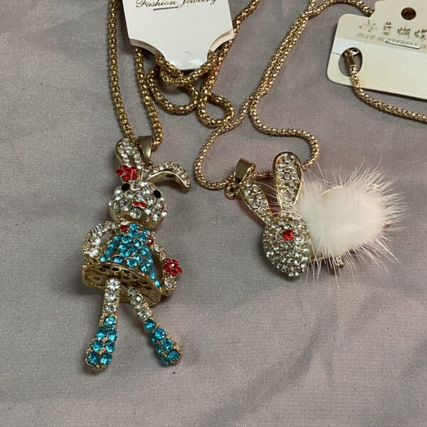 Colourful stone rabbit pendant necklace on gold chain.