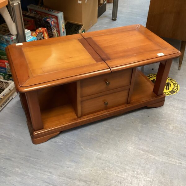 Vintage rolling coffee table with drawers on wheels.