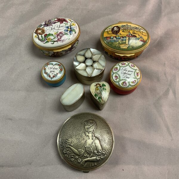 Halcyon Days enamel pill pots, a vintage collectible collection.