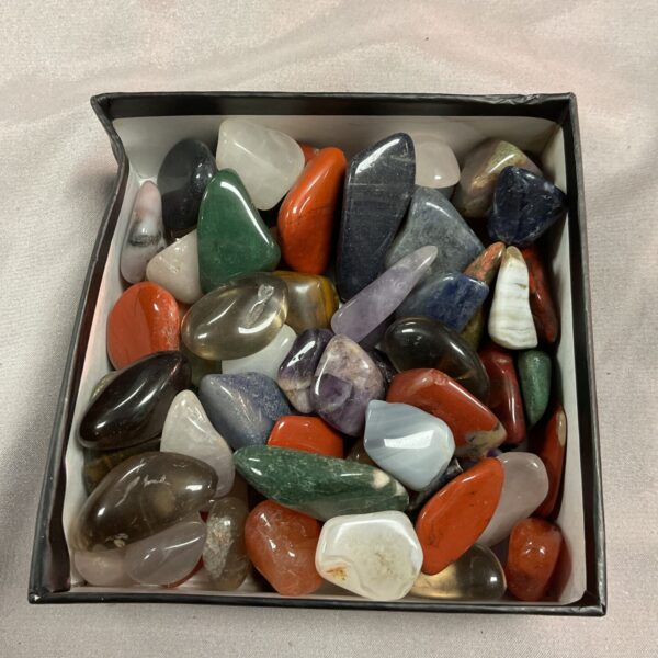 Close-up of a polished stone collection with varied colours and textures.