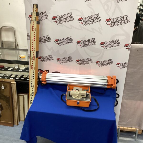 Asahi AL-6B auto level surveying kit with tripod and rule.