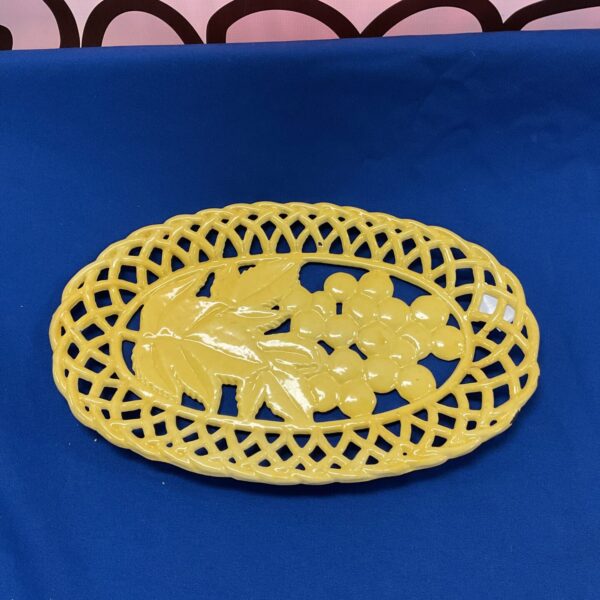 Vintage cast iron decorative dish with intricate floral pattern.