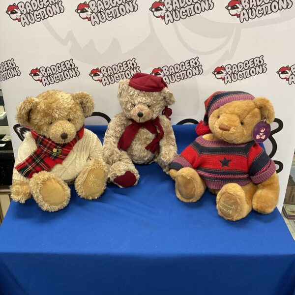 Lot of three Harrods collector teddy bears displayed indoors.