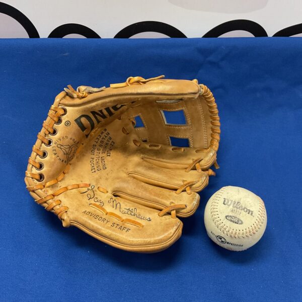 Vintage Spalding baseball mitt with Wilson baseball, collectible sports item.