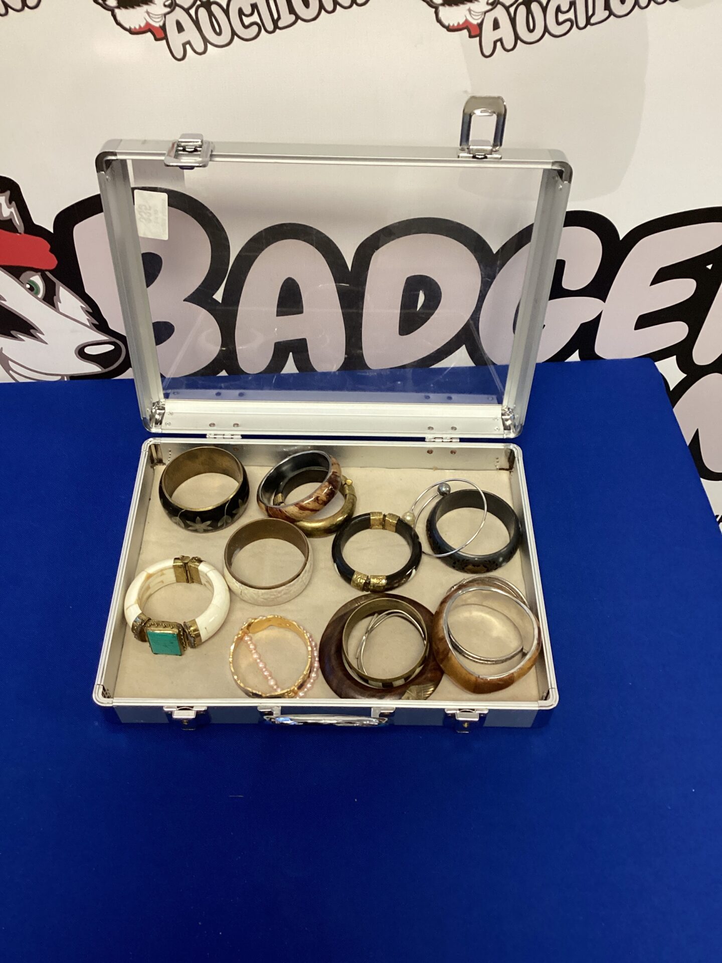 335 Selection of Bangles in Aluminium Case