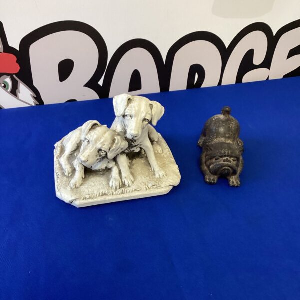 Vintage ceramic dog ornaments on a shaped base.
