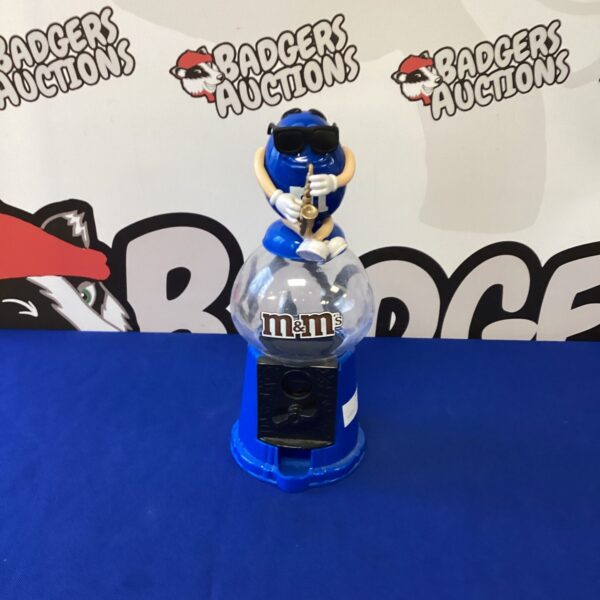 Vintage blue M&M dispenser, retro candy machine collectible.