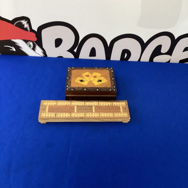 Vintage wooden cribbage board for classic card game play.