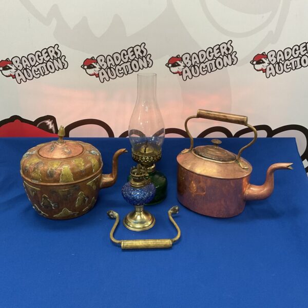 Vintage copper kettles and oil lamps in a collectible lot.
