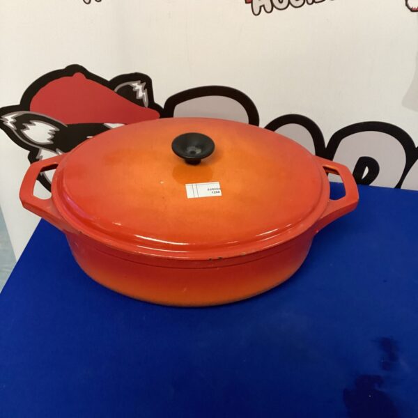 Vibrant orange cast iron casserole pot for cooking and serving.