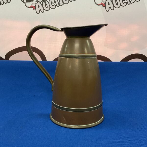 Vintage copper jug with patina, ideal for collectors.