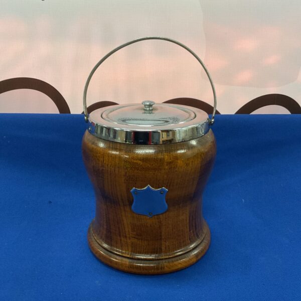 Vintage oak musical ice bucket with silver plate accents.
