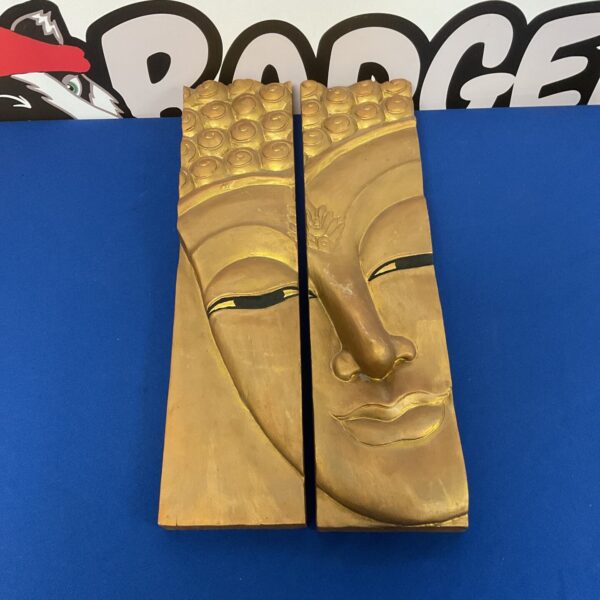 Intricately carved wooden Buddha wall art panel for home decor.