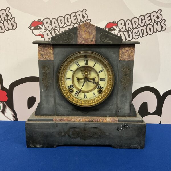 Antique Ansonia slate mantle clock with marble accents.