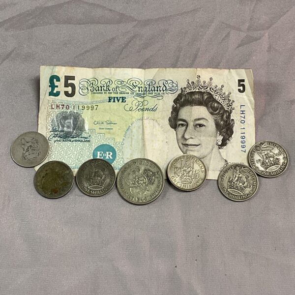 Vintage British £5 note and coins, collectible currency lot.