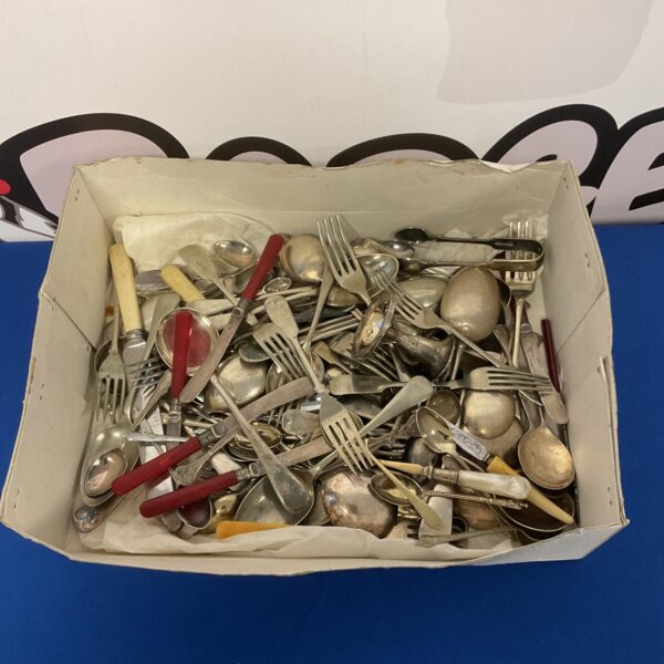 Vintage silver plate cutlery tray with mixed flatware pieces.