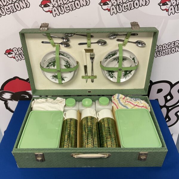 Open vintage Brexton picnic set with enamelware and thermos flasks.