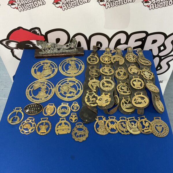 Vintage horse brasses and canal barge plaque collection for collectors.
