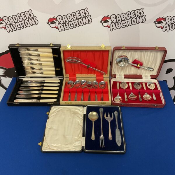 Vintage silver plate cutlery sets in wooden boxes.