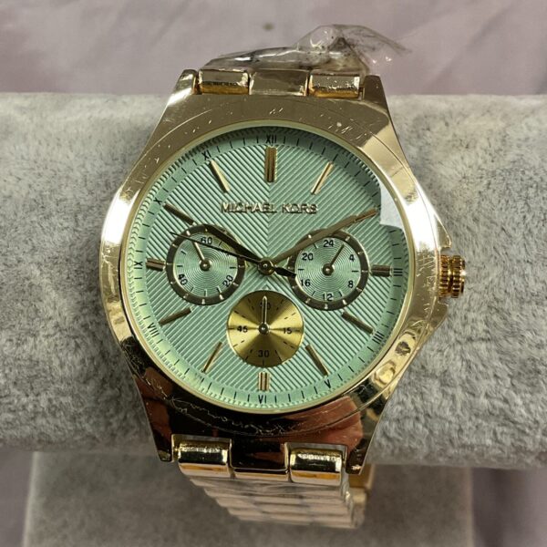Gold-tone Michael Kors gents watch with a clear dial.