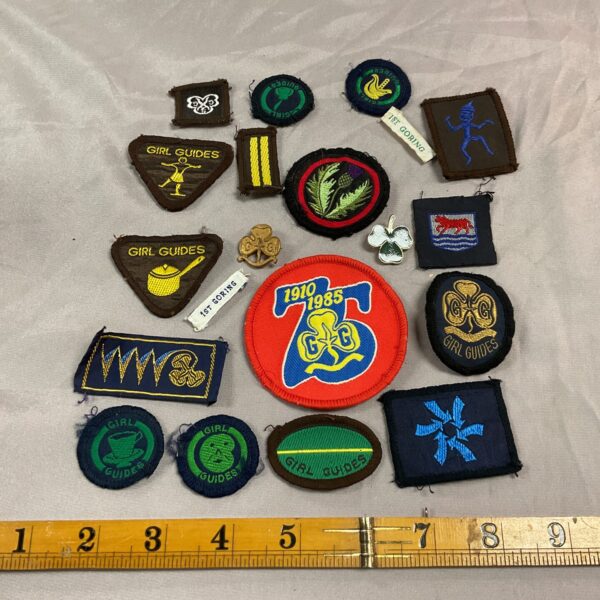 Vintage Girl Guides badges collection, embroidered scout patches for collectors.
