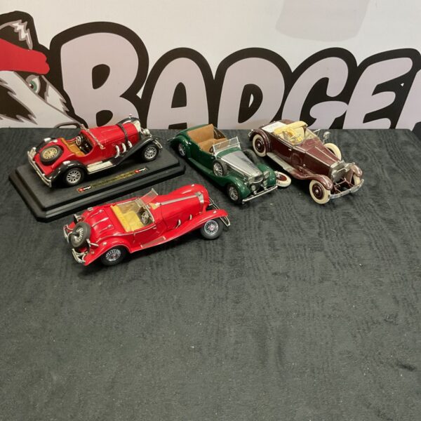 Diecast model cars lot featuring Burago and Franklin Mint vehicles.