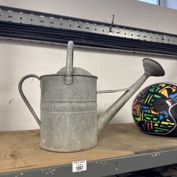 Vintage galvanised watering can for garden use.