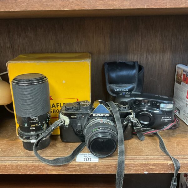 Vintage Olympus OM-2 camera with Yashica Zoomate 70 lens for sale.