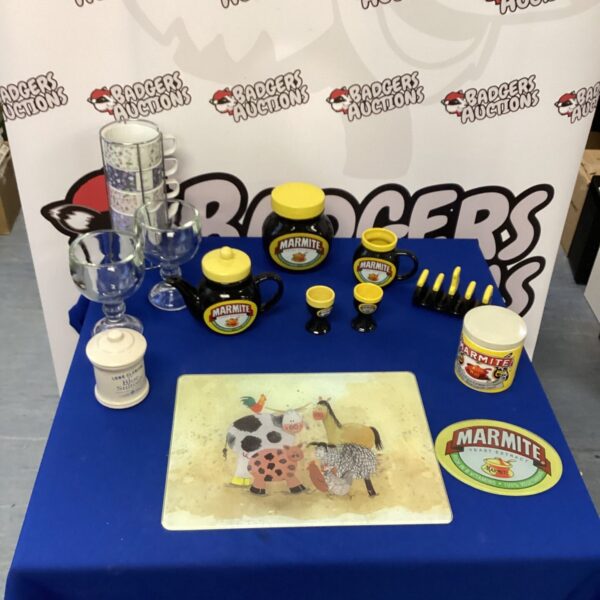 Vintage Marmite pottery jars and collectibles on display.