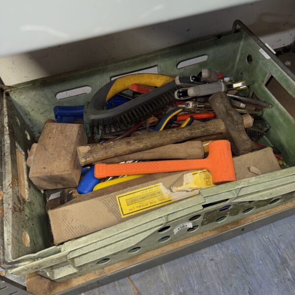 Vintage tool tray filled with assorted hand tools and hardware.