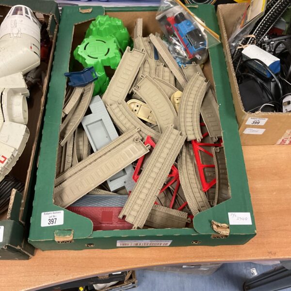 Mixed lot of Thomas the Tank Engine trains and track pieces.