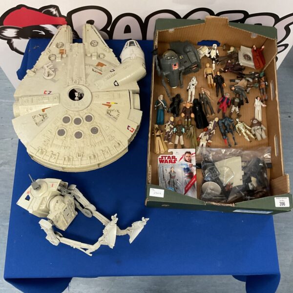 Vintage Star Wars Millennium Falcon and action figure collection.