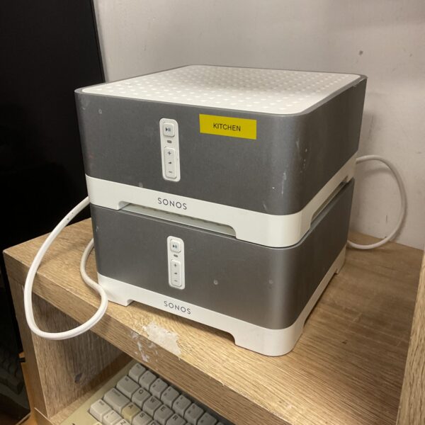 White Sonos Connect amplifier for wireless audio streaming.